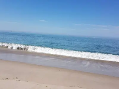 an empty beach with the ocean in the background at 10 person holiday home in Harboøre in Harboør
