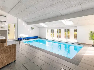 a large swimming pool in a building at Luxury Retreat in Klitmoller - By Traum Ferienwohnungen in Thisted