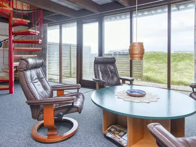a living room with two chairs and a table at 5 person holiday home in Harboøre-By Traum in Harboør