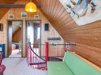 a house with a slide in a room with wooden walls at 5 person holiday home in Harboøre-By Traum in Harboør