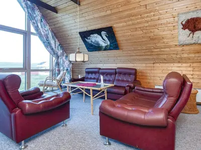 a living room with leather chairs and a table at 5 person holiday home in Harboøre-By Traum in Harboør