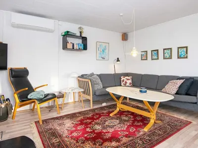 a living room with a couch and a table at 6 person holiday home in Lemvig in Lemvig