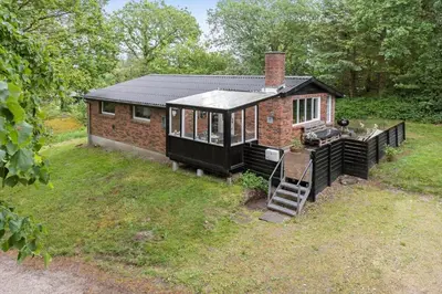 a small brick house with a porch and a staircase at LF12164-Spottrup-Nobilisvej-3 in Spottrup