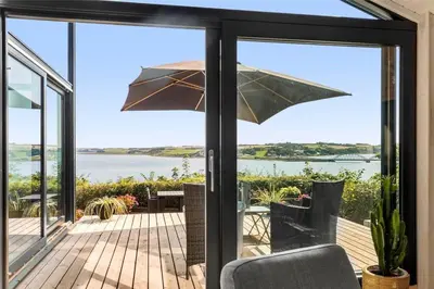 a sliding glass door with a view of the water at LF473-Thisted-Asvej-73 in Thisted
