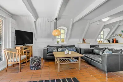 a living room with a couch and a table at LF14258-Fur-Marehalmvej-8 in Fur