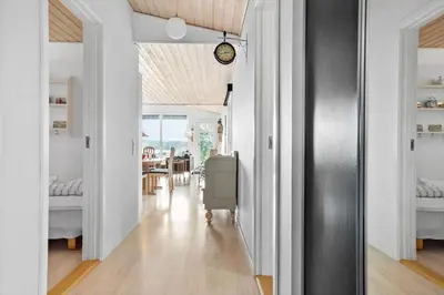 a hallway of a home with a clock on the ceiling at LF14198-Roslev-Bagvejen-2 in Roslev