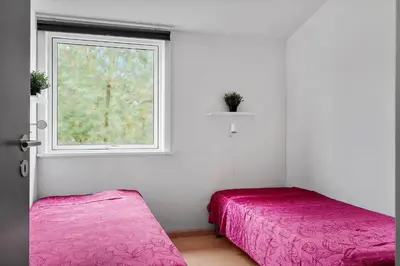 a bedroom with two beds and a window at LF10320-Hurup-Thy-Nattergalevej-2-B in Sønder Ydby