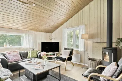 a living room with a couch and a fireplace at LF11109-Struer-Barsidalvej-9 in Struer