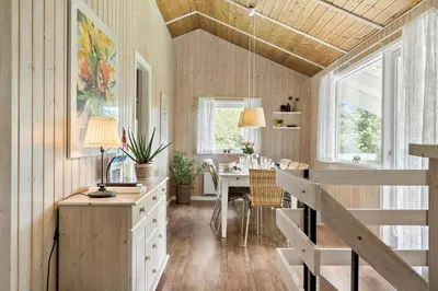 a kitchen with a table and a dining room at LF11109-Struer-Barsidalvej-9 in Struer