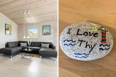 a living room with a couch and a ball that says i love thy at LF101-Vestervig-Hellesvej-1 in Vestervig