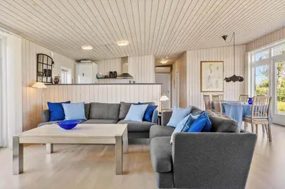 a living room with a couch and a table at LF14038-Roslev-Stranddalen-119 in Roslev