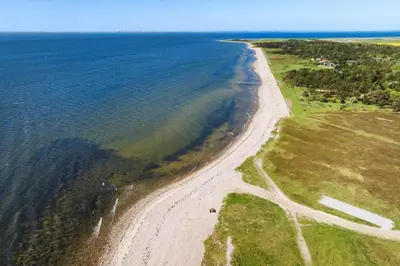 an aerial view of a beach next to the ocean at LF10314-Hurup-Thy-Edderfuglevej-15 in Sindrup
