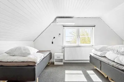 two beds in a room with a window at LF14145-Spottrup-Uglkaeret-5 in Spottrup