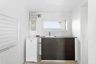 a small kitchen with a sink and a window at LF14145-Spottrup-Uglkaeret-5 in Spottrup