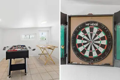 a dart board and a table in a room at LF14145-Spottrup-Uglkaeret-5 in Spottrup