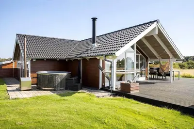 a house with a deck with a hot tub at LF12725-Vinderup-Kildebakken-25 in Vinderup