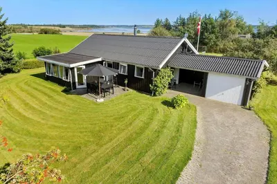 an aerial view of a house with a large yard at LF15194-Hojslev-Spaettevej-14 in Højslev