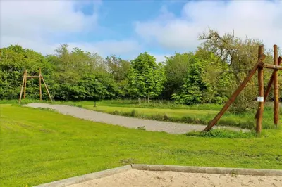 a park with a swing set in the grass at LF112-Vestervig-Ingeborgs-Alle-12 in Vestervig