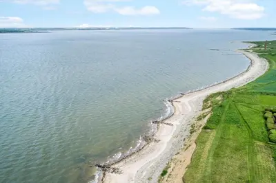 an aerial view of a beach and the ocean at LF14137-Spottrup-Fjordvej-39 in Spottrup