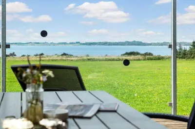 a table in front of a window with a view of a field at LF14137-Spottrup-Fjordvej-39 in Spottrup
