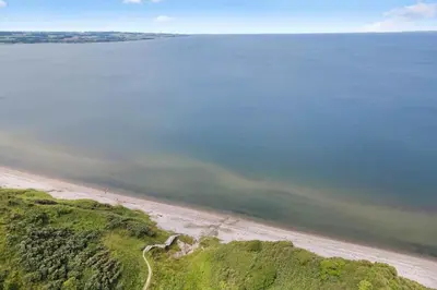 an aerial view of a beach and the ocean at LF11107-Struer-Skovvej-7 in Struer