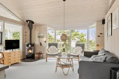 a living room with a couch and a table at LF11107-Struer-Skovvej-7 in Struer