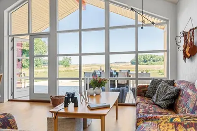 a living room with a couch and a table at LF13174-Nykobing-mors-Feggesundvej-70 in Nykøbing Mors