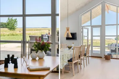 a dining room and a living room with a table at LF13174-Nykobing-mors-Feggesundvej-70 in Nykøbing Mors