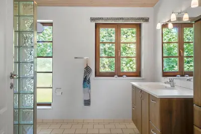 a bathroom with a sink and two windows at LF11597-Struer-Plantagevej-97 in Struer