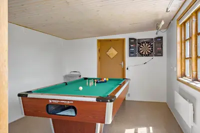 a room with a pool table in a room at LF11597-Struer-Plantagevej-97 in Struer