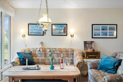 a living room with a couch and a table at LF10221-Thyholm-Haervej-21 in Thyholm