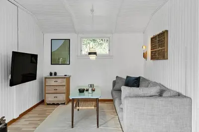 a living room with a couch and a table at LF11108-Struer-Barsidalvej-8 in Struer