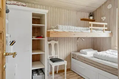 a room with two bunk beds and a table at LF11108-Struer-Barsidalvej-8 in Struer