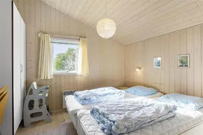 a bedroom with two beds and a window at LF884-Snedsted-Kongens-Borer-2 in Snedsted