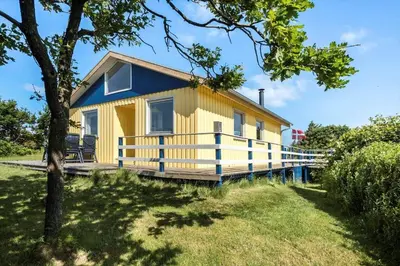 a yellow and blue house on a dock at LF11111-Struer-Granvej-11 in Struer