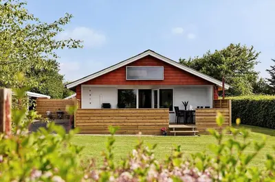 a small house in a yard with a garden at LF11103-Struer-Blabaervej-3 in Struer