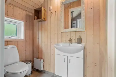a bathroom with a white sink and a toilet at LF21631-Spottrup-Vibevej-3 in Spottrup