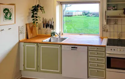 a kitchen with a sink and a window at Lovely Home In Karby With Wifi in Karby