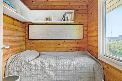 a small bedroom with a bed and a window at JB356-Frostrup-Horsbakkevej-6 in Frøstrup