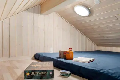 a room with a bed in a tiny house at JB232-Brovst-Kronvildtvej-20 in Brovst