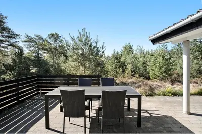 a table and chairs sitting on a patio at JB193-Fjerritslev-Blabaerstien-78 in Fjerritslev