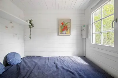 a bedroom with a bed and a window at JB160-Fjerritslev-Skovstien-7 in Fjerritslev