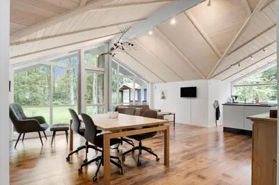 a dining room with a table and chairs at JB901-Aabybro-Graanden-40 in Åbybro
