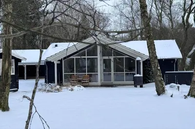 a house covered in snow in the yard at JB901-Aabybro-Graanden-40 in Åbybro