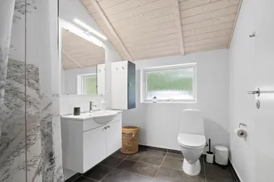 a white bathroom with a toilet and a sink at JB901-Aabybro-Graanden-40 in Åbybro