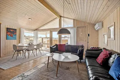 a living room with a couch and a table at JB340-Frostrup-Krinkelkrogen-14 in Frøstrup