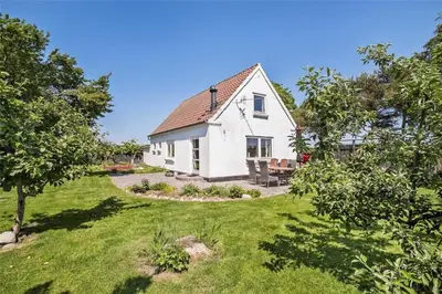 an image of a white house with a yard at JB151-Brovst-Tranum-Engevej-137 in Brovst