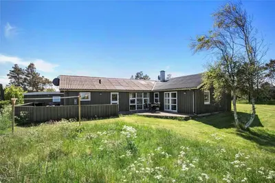 a house with a grassy yard in front of it at JB785-Fjerritslev-Tolderstien-24 in Fjerritslev