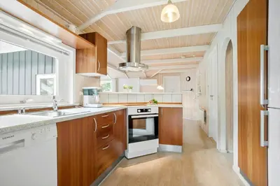a kitchen with a sink and a stove top oven at JB818-Fjerritslev-Ronnevej-20 in Fjerritslev