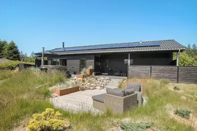 a house with a couch in the middle of a yard at JB164-Fjerritslev-Poppelvej-16 in Fjerritslev